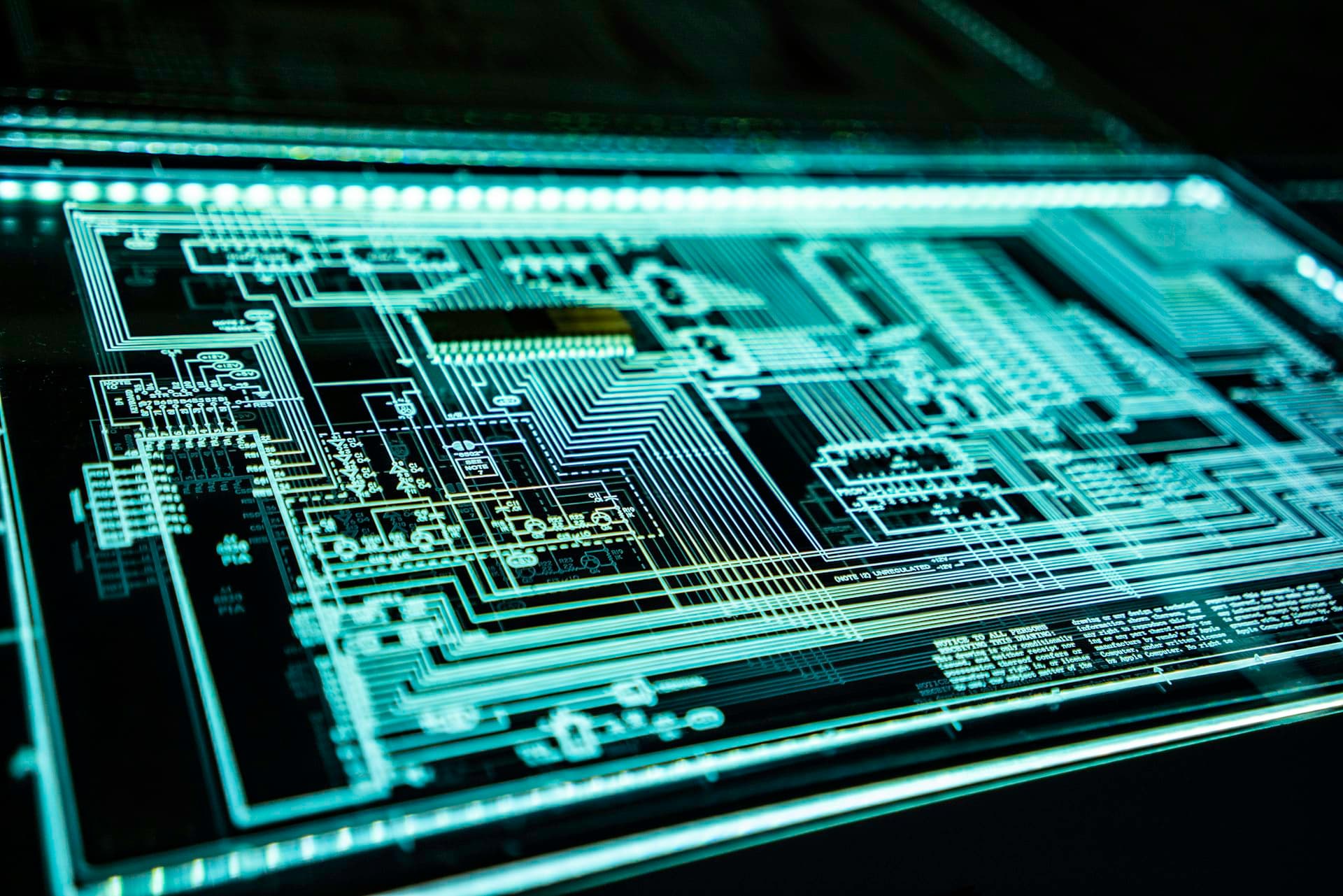 Illuminated circuit schematic glowing in the dark